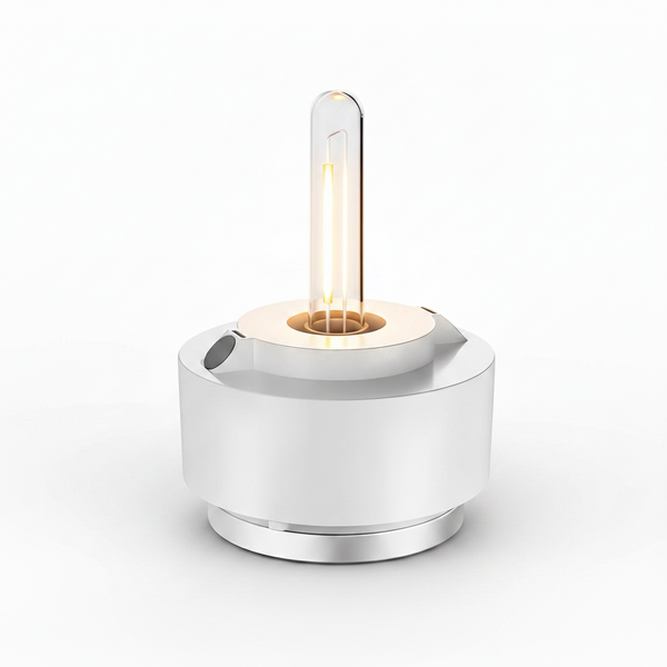 HOPEN Salt Water Lamp with exposed Edison-style filament bulb, white cylindrical base with chrome accents, glowing warm amber light, isolated on white background. 