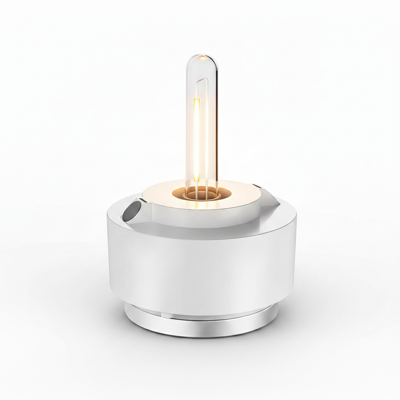 HOPEN Salt Water Lamp with exposed Edison-style filament bulb, white cylindrical base with chrome accents, glowing warm amber light, isolated on white background. 